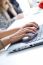 Woman Hands Typing On Laptop