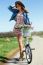 Beautiful Young Woman With A Vintage Bike In The Field