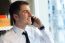 Young Businessman Using His Mobile Phone In Office