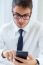 Young Handsome Man Working In His Office With Mobile Phone