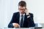 Young Handsome Man Working In His Office With Mobile Phone