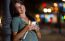 Beautiful Woman Use Her Phone In The City At Night