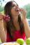 Young Girl Eating Grapes On Romantic Picnic In Countryside