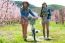 Two Beautiful Young Women With A Vintage Bike In The Field