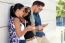 Portrait Of Group Of Friends Having Fun With Smartphones