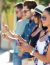 Portrait Of Group Of Friends Having Fun With Smartphones