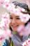 Beautiful Young Woman With Flowers In The Field