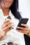 Young Pretty Business Woman With Mobile Phone In Her Office