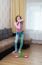 Young Brunette Woman Standing With Mop