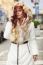 Beautiful Woman In Fur Coat On Street