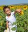 Kid And Sunflowers