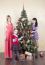 Two Young Women And Little Girl Near A Christmas Tree