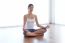 Beautiful Young Woman Doing Yoga Exercises At Home