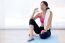 Beautiful Young Woman Drinking Water After A Workout At Home