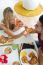 Happy Young Couple Enjoying Breakfast In The Kitchen