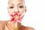 Pretty Woman With Lily Flower In Mouth