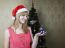 Young Girl Holding A Christmas Toy