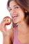 Portrait Of A Healthy Girl Smiling With Apple