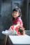 Toothy Smiling Face Of Asian Kid Happiness Emotion And Dry Flowers Bouquet Beside