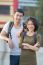 Couples Of Younger Asian Man And Woman Relaxing With Happy Face On Vacation Trip