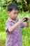 Little Boy Taking Photos By Digital Camera On Smartphone With Go