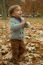 Little Boy In Autumn Leaves