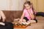 Girl Playing Draughts With Her Mother