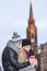 Young Couple In Love Embracing And Drinking Hot Drink From Red C