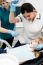 Lady Dentist Checking Girl's Teeth