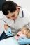 Cute Kid Getting Dental Checkup