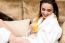 Woman In Bathrobe Drinking Orange Juice