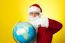 Ages Man In Santa Costume Holding Globe