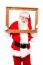 Santa Posing Holding Wooden Frame