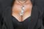 Woman With Big Breasts And Jewelry On Neck