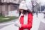 Beautiful Woman In Red Coat And Wool Cap And Gloves With Smartph