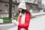 Beautiful Woman In Red Coat And Wool Cap And Gloves With Smartph