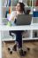 Pretty Young Woman Working With Laptop In Her Office