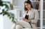 Pretty Young Woman Using Digital Tablet In The Office