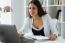 Pretty Young Woman Working With Laptop In Her Office