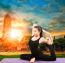 Asian Woman Health Care Yoga Posting With Asian Ancient Pagoda Temple And Sun Set Sky