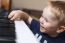 Small Boy Enjoys Playing Electric Piano