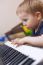 Small Boy Enjoys Playing Electric Piano