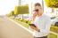 Businessman With Mobile Phone And Tablet In Hands