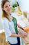 Pretty Young Woman Cutting Vegetables In The Kitchen