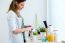 Pretty Young Woman Enjoying Breakfast In The Kitchen