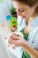 Beautiful Young Woman Eating Cereals In The Kitchen