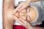 Woman Having Facial Mask At Beauty Salon