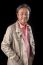 Portrait Close Up Smiling Happiness Face Of 59s Years Old Asian Man With Studio Light Against Black Background