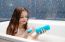 Little Smiling Girl Taking A Bath