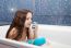 Little Smiling Girl Holding Blue Soap And Sponge